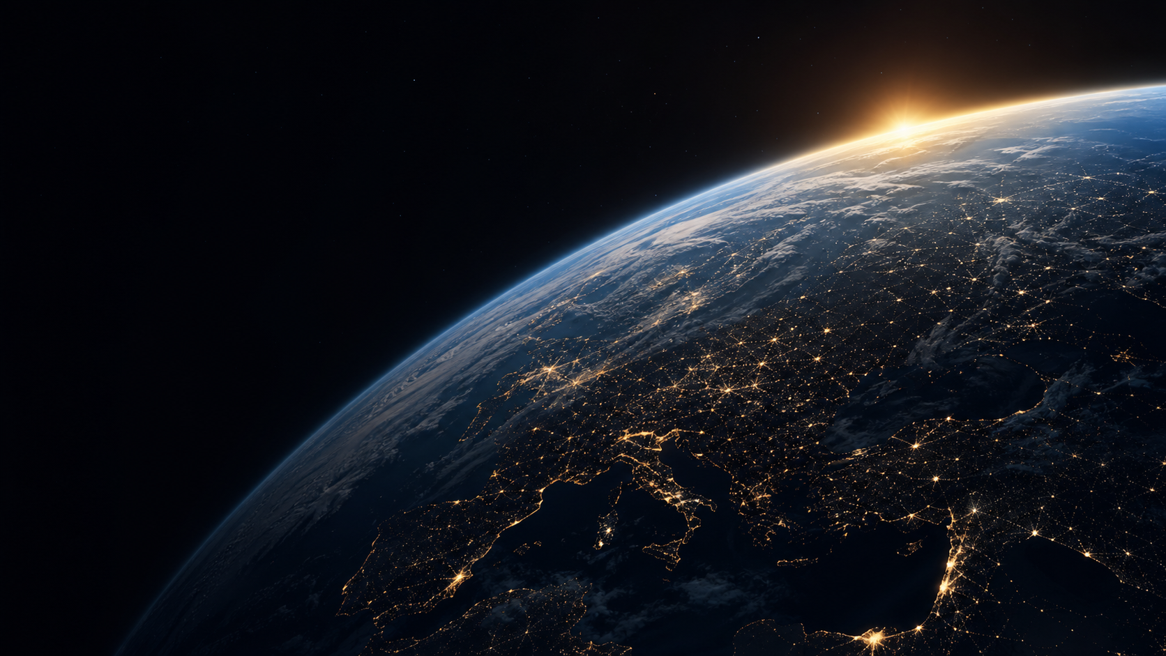Earth seen from orbit with sunrise over the horizon